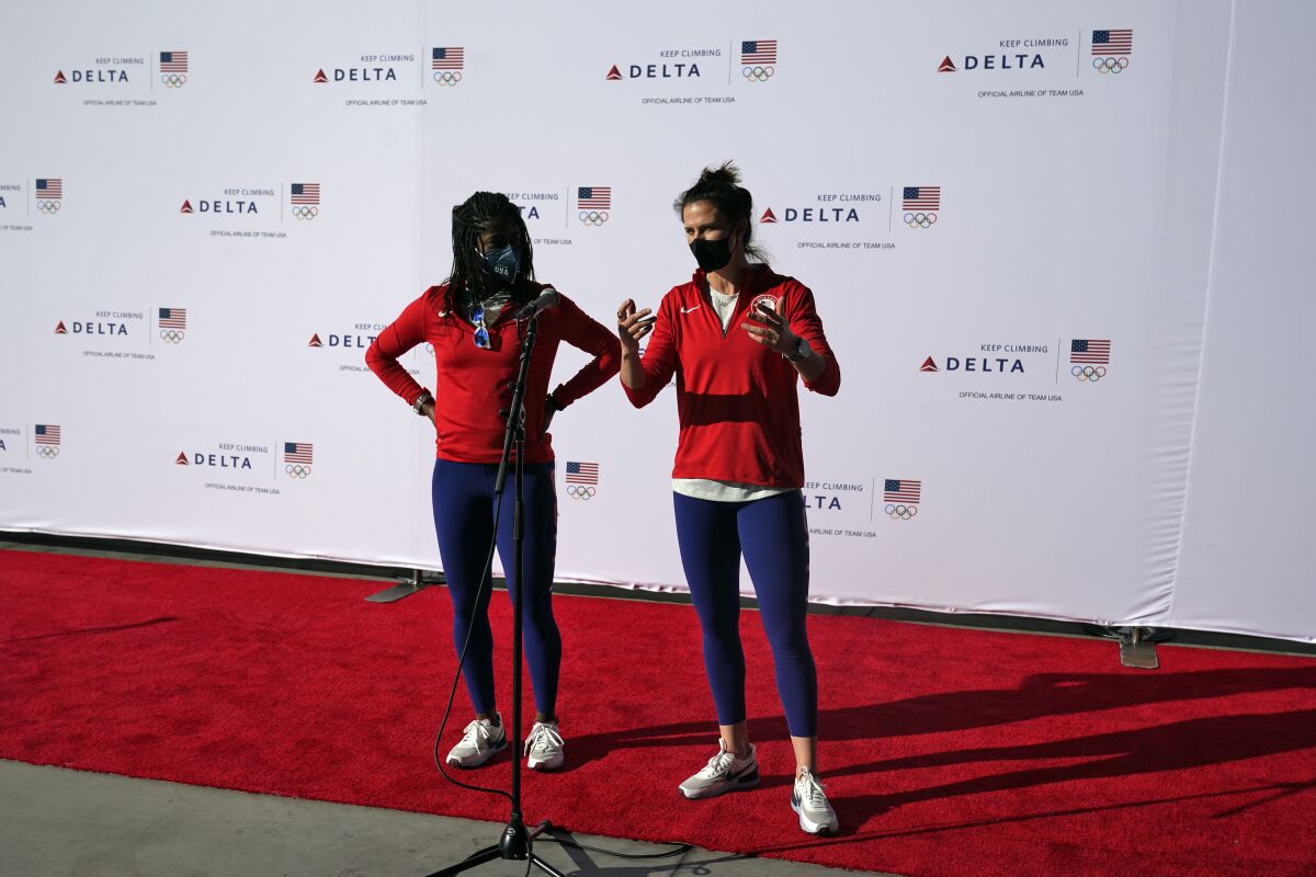 Speedskaters Erin Jackson, left, and Brittany Bowe answer questions before the Olympics.