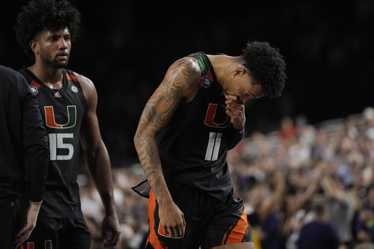 Miami guard Jordan Miller reacts to their loss against Connecticut during the second half of a Final Four college basketball game in the NCAA Tournament on Saturday, April 1, 2023, in Houston. (AP Photo/David J. Phillip)