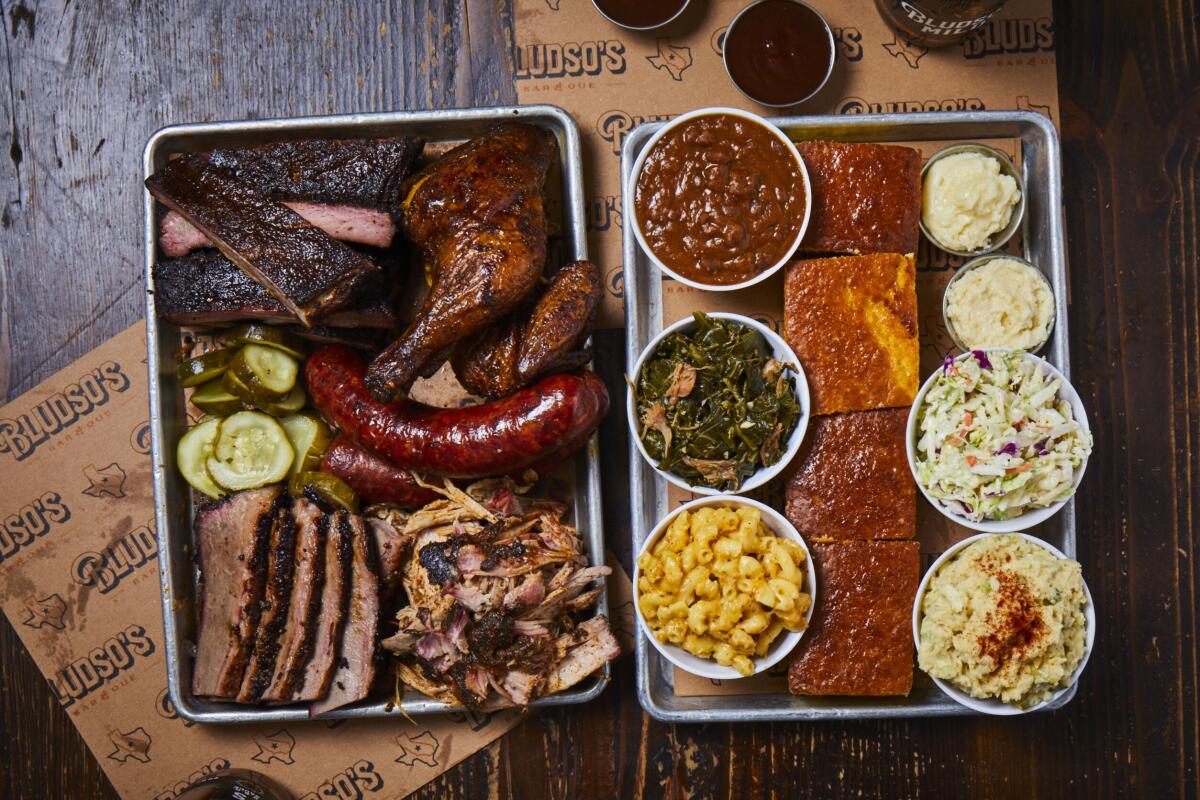 Smoked meats including ribs, brisket, links, pulled pork and chicken, with sides