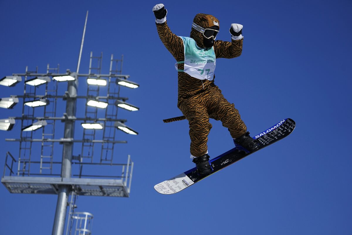 Lucile Lefevre of France competes during the women's snowboard big air qualifications of the 2022 Winter Olympics, Monday, Feb. 14, 2022, in Beijing. (AP Photo/Ashley Landis)