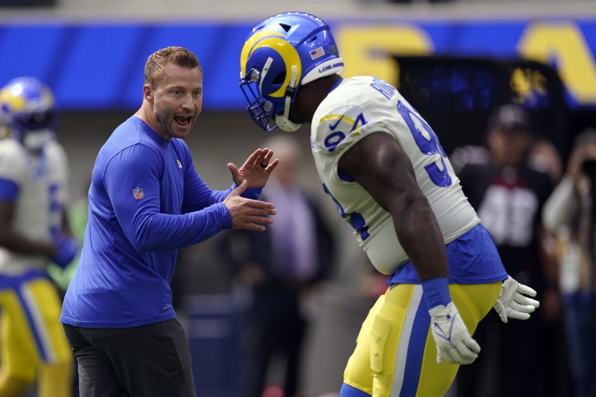 Rams coach Sean McVay talks with defensive tackle A'Shawn Robinson.