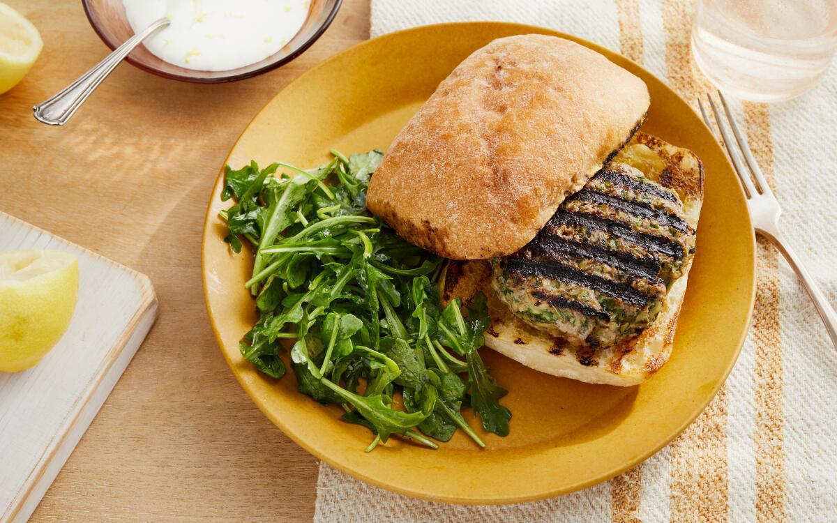 Zucchini adds moisture to lamb burgers topped with yogurt and cold, crunchy arugula. Prop Styling by Kate Parisian.