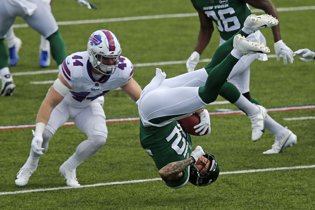 New York Jets safety Ashtyn Davis (32) is upended while returning a kick off with Buffalo Bills inside linebacker Tyler Matakevich (44) defending during the second half of an NFL football game in Orchard Park, N.Y., Sunday, Sept. 13, 2020. The Bills won 27-17. (AP Photo/John Munson)