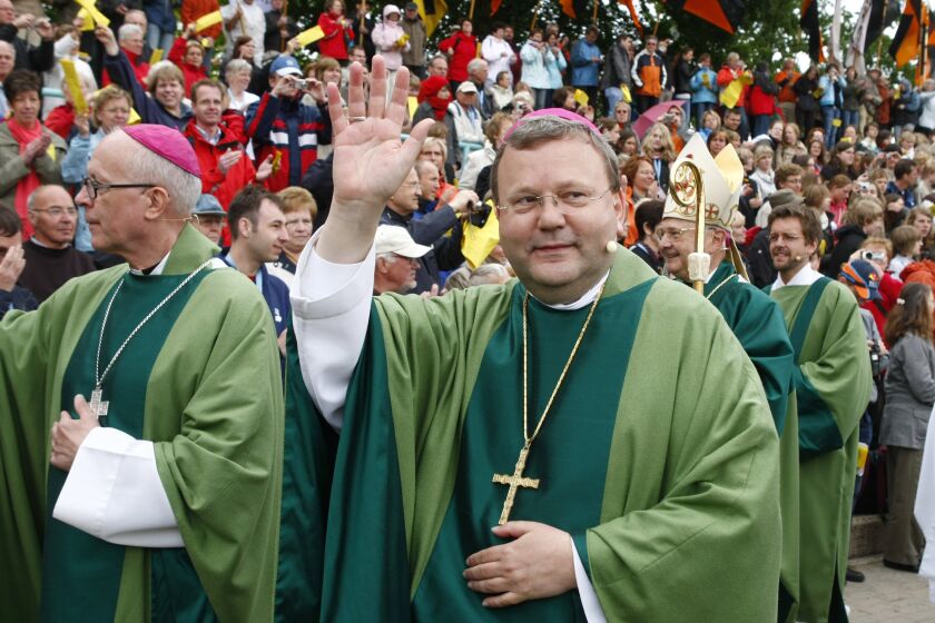 FILE - In this May 25, 2008, file photo, Bishop Franz-Josef Bode waves during the closing service of the 97th German Catholics Day in Osnabrueck, northern Germany. Pope Francis on Saturday, March 25, 2023 accepted a resignation request from a German bishop who asked to step down because of his mistakes in handling sexual abuse cases. Franz-Josef Bode became the bishop of Osnabrueck, Germany, in 1995. (AP Photo/Joerg Sarbach, File)