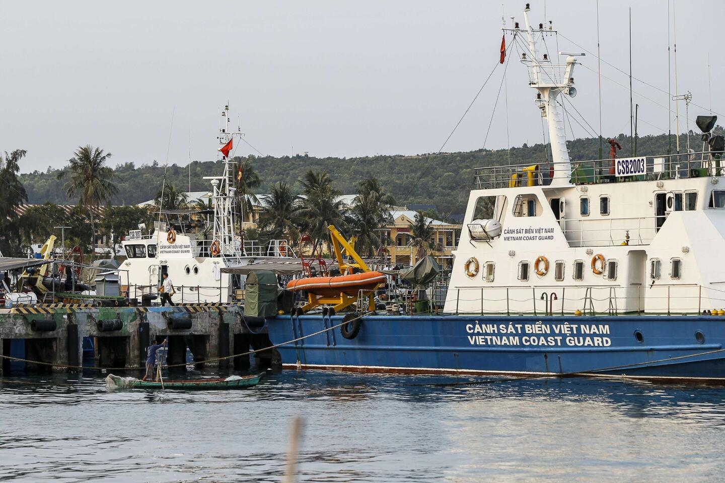A Vietnam coast guard ship is seen anchored at a local naval base at Phu Quoc island, in the waters of southern Vietnam, where a Malaysian Airlines jet was presumed lost.