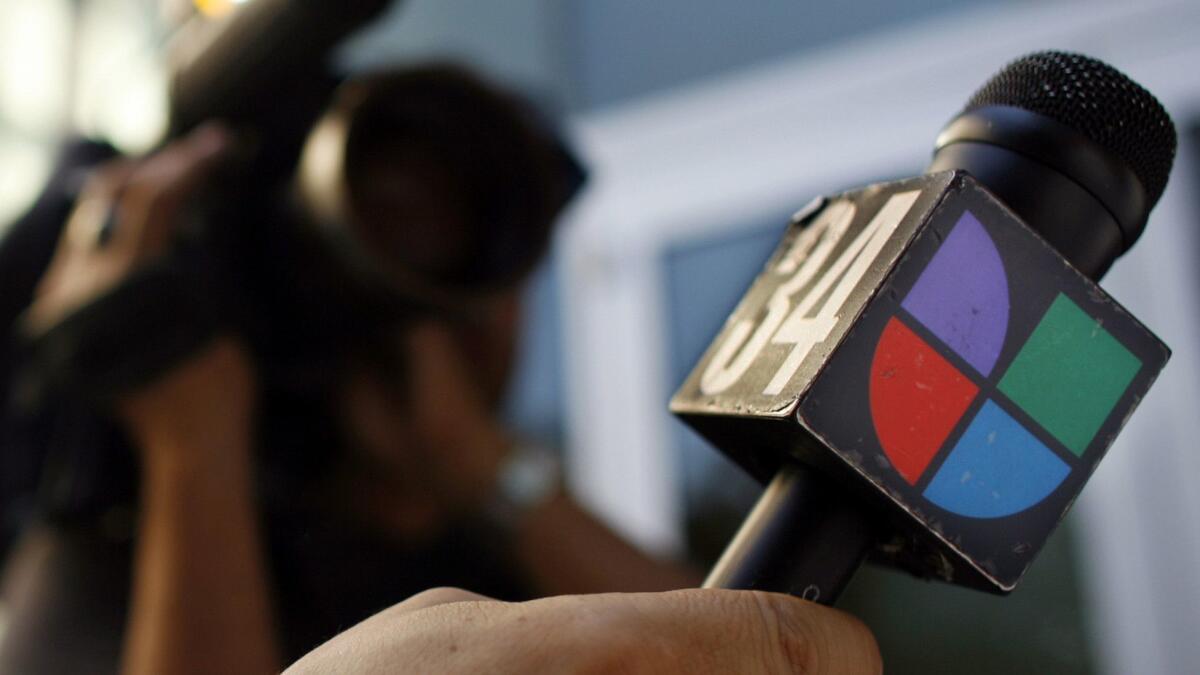 A microphone bearing the logo of Spanish-language broadcaster Univision.