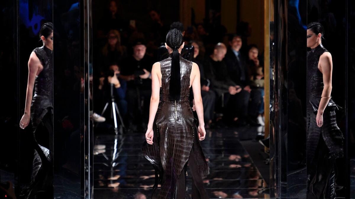 Kendall Jenner in a crocodile-textured dress at the Balmain fall/winter 2017 runway presentation on March 2.
