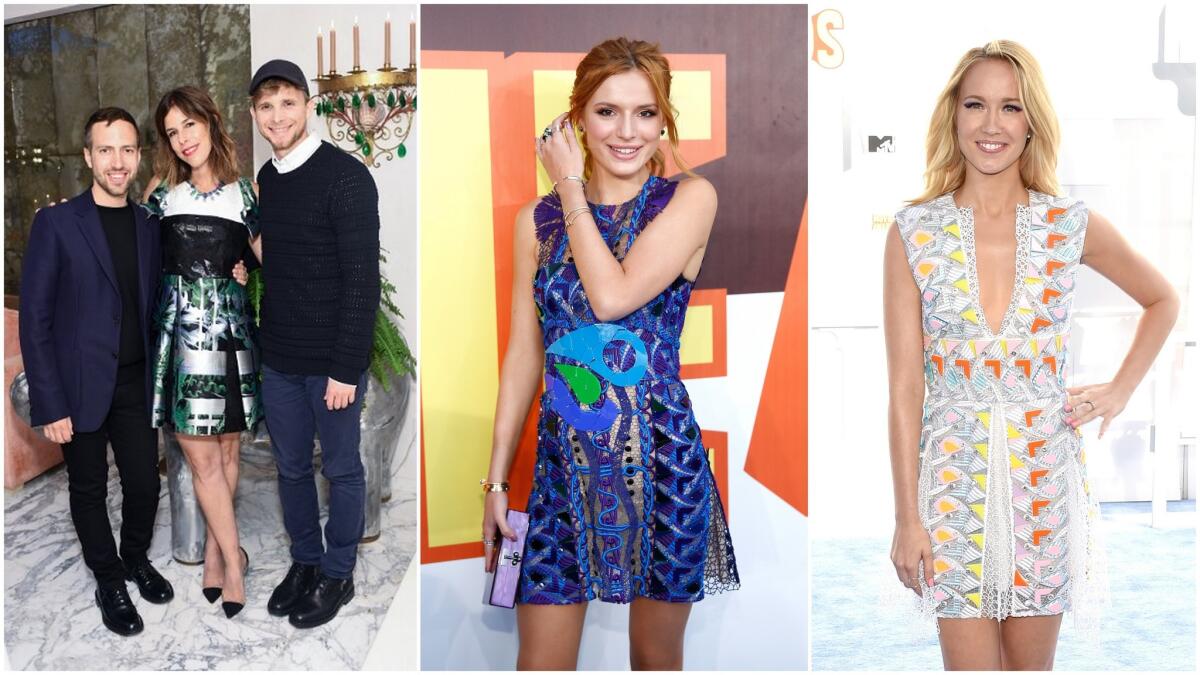 From left: Designer Peter Pilotto, L.A. jeweler Irene Neuwirth and designer Christopher de Vos pose at Neuwirth's West Hollywood boutique. Actress Bella Thorne, center, and actress Anna Camp wear Peter Pilotto mini-dresses to the 2015 MTV Movie Awards.