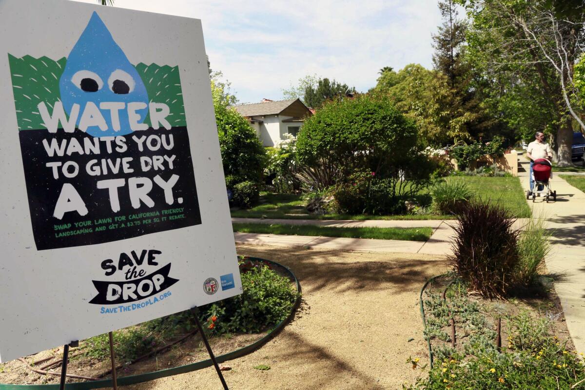 A sign, displayed at a news conference on April 9, encourages people to save water. Los Angeles Mayor Eric Garcetti introduced Angelenos to "the Drop," a cartoon character that will serve as a reminder to save water and take advantage of the city's rebate programs.