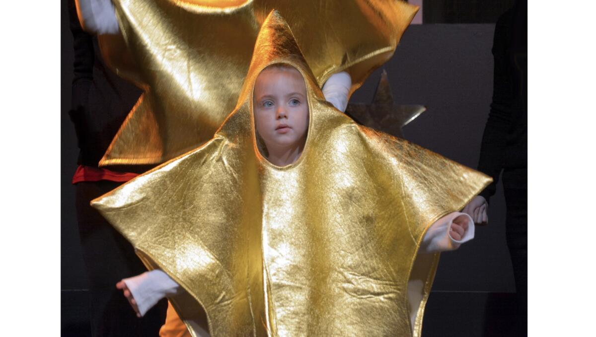 Lighting the way for the Star of Bethlehem is little star Bailey Warner.