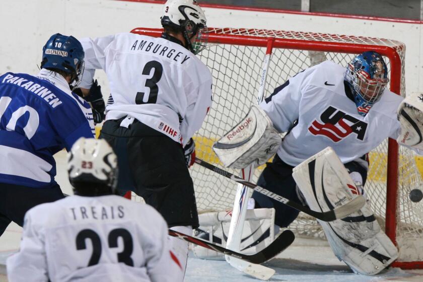 FILE - In this Nov. 8, 2008, file photo, United States' goalie Brandon Maxwell catches the puck as Tyler Amburgey (3) moves in to defend against Finland's Joonas Hurri (3) while United States' A.J. Treais (23) watches the play during the under 18 men's Four Nations Cup Hockey Tournament Championship game in Lake Placid, N.Y. USA Hockey named David Leggio and Brandon Maxwell as the final two goaltenders for its Olympic team. U.S. general manager Jim Johannson on Thursday, Jan. 11, 2018, announced the final two players on the 25-man roster. (AP Photo/Todd Bissonette, File)