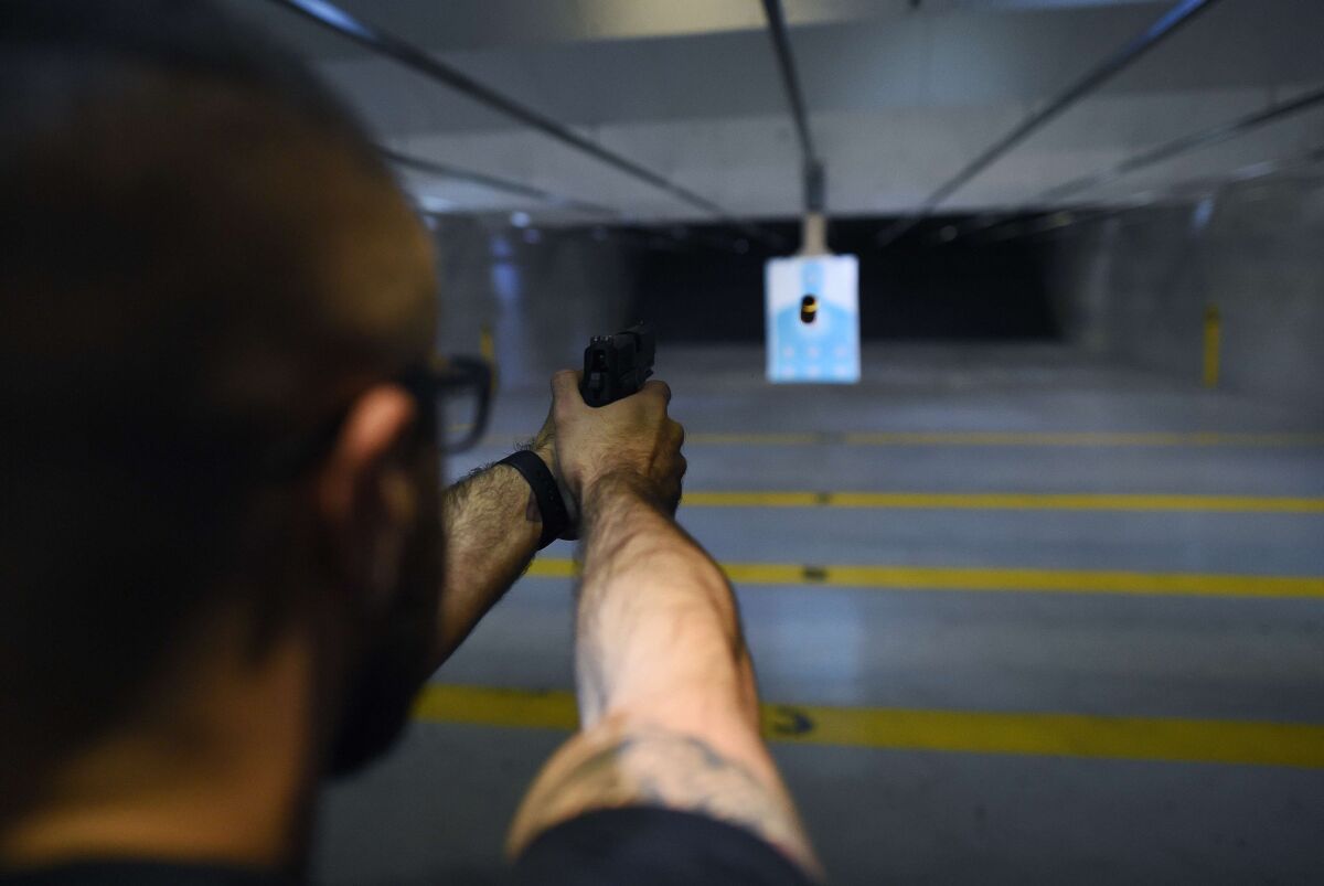 One obstacle to gun owners’ acceptance of safety technology is its identification with anti-gun activism. Above, a man fires a handgun at a shooting range in New Jersey.