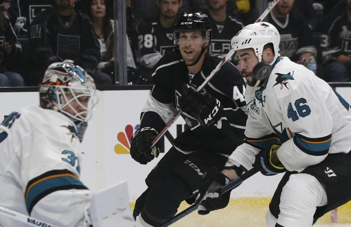 Kings center Vincent Lecavalier fires a shot past Sharks defenseman Roman Polak but wide of the goal in front of goalie Martin Jones during the first period.