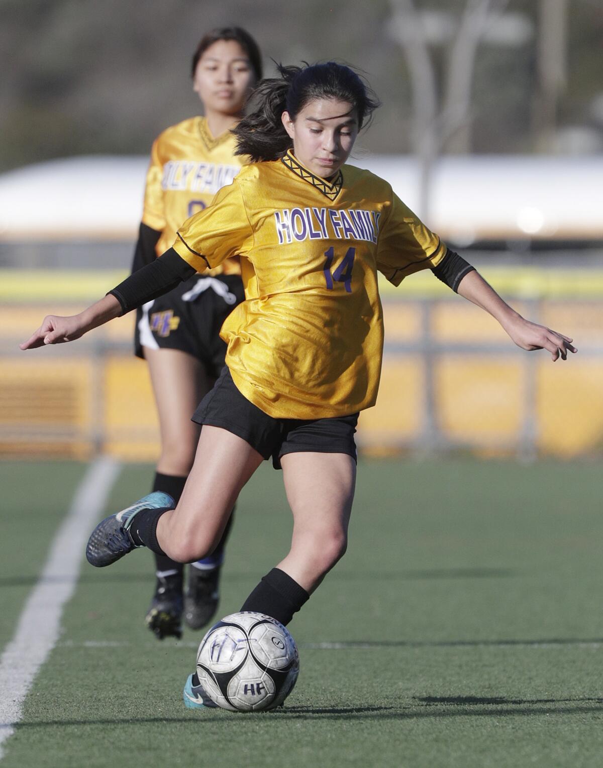 Holy Family's Maya Devora sends the ball on a long pass against Alverno Heights in a Horizon League girls' soccer game at the Glendale Sports Complex in Glendale on Monday, January 27, 2020.