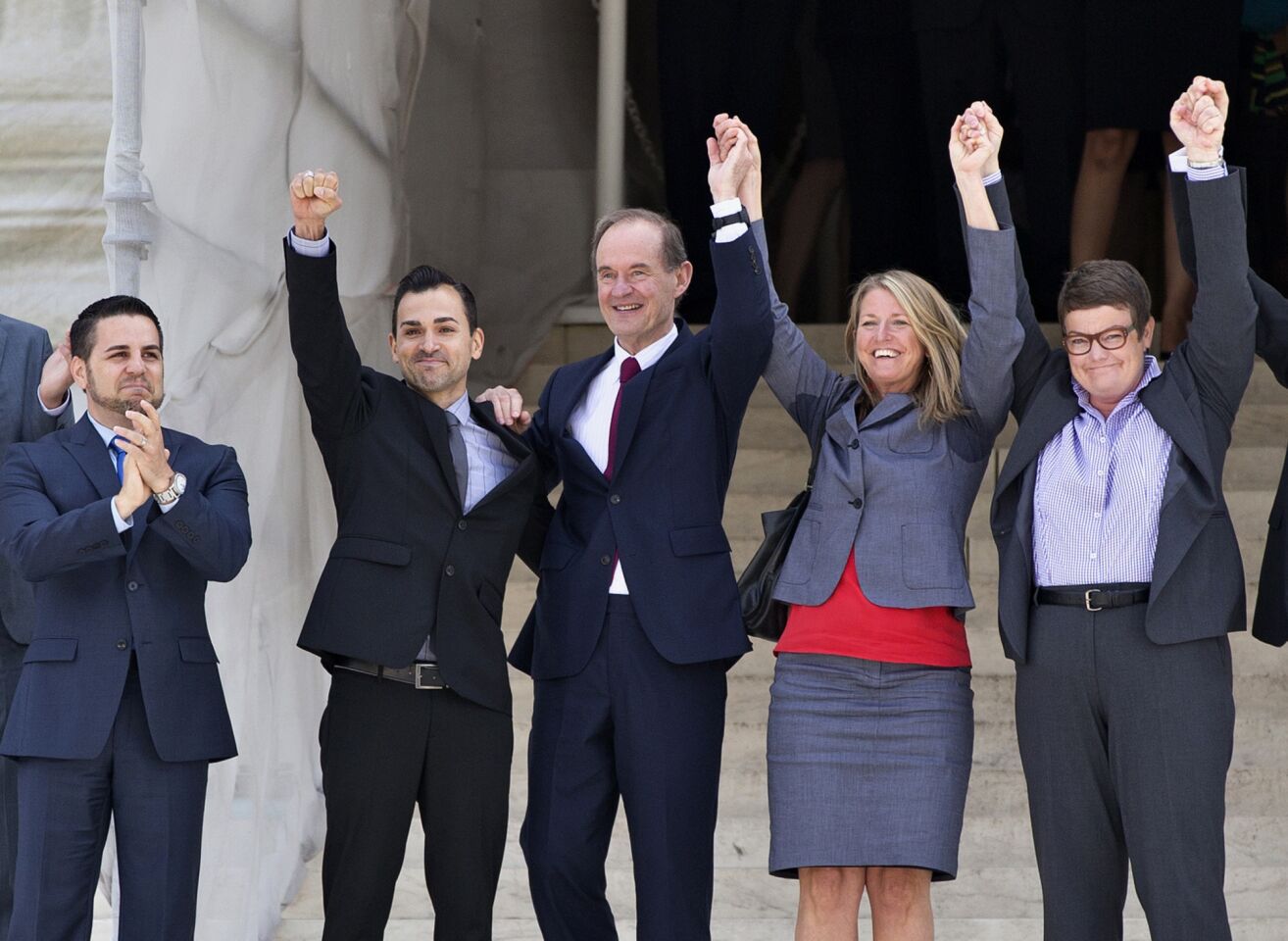 The plaintiffs' team in Hollingsworth vs. Perry, the California Proposition 8 case, celebrate on the steps of the Supreme Court after Wednesday's ruling was handed down. From left are Jeff Zarrillo, his partner, Paul Katami, attorney David Boies, Sandy Stier and her partner, Kris Perry.