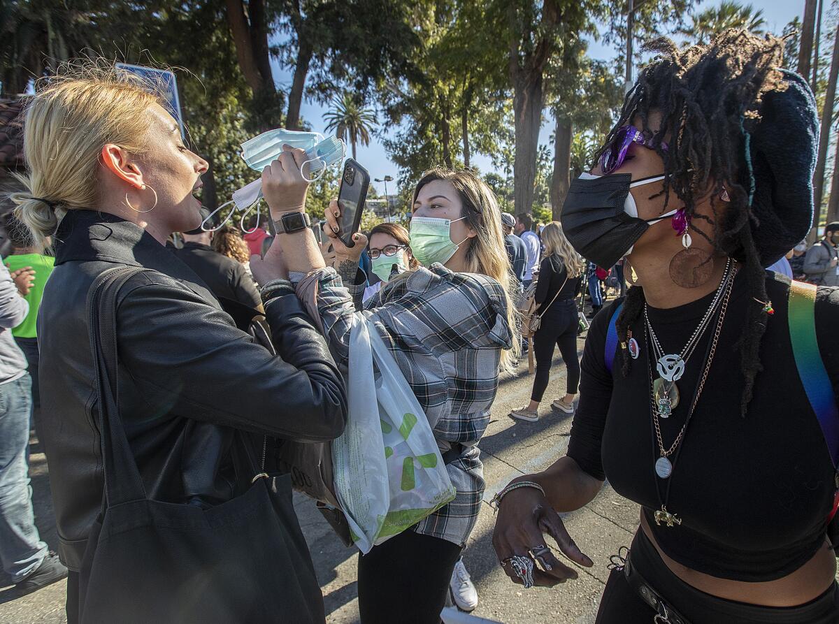 Jacky RoDerte gets into an altercation with a woman while offering her a mask at Echo Park Lake