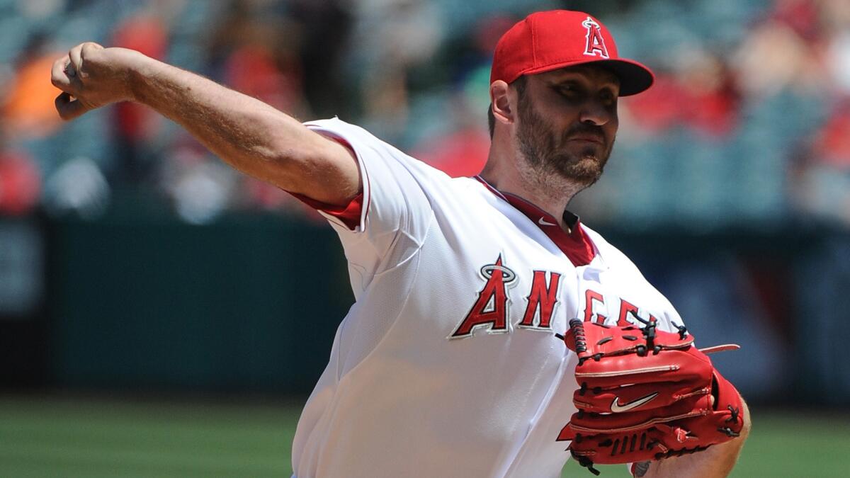 Angels reliever Kevin Jepsen delivers a pitch during the team's 14-3 win over the Texas Rangers on Sunday.
