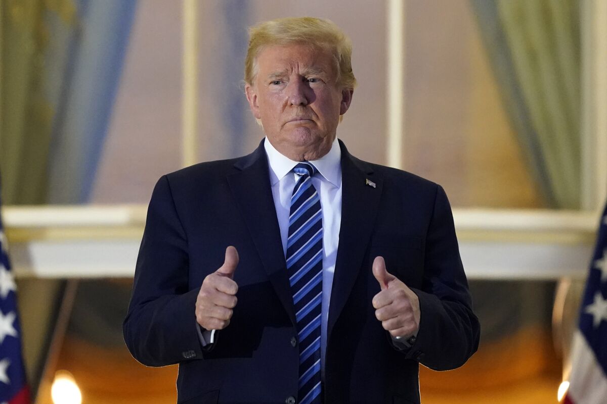 President Trump gives two thumbs up.