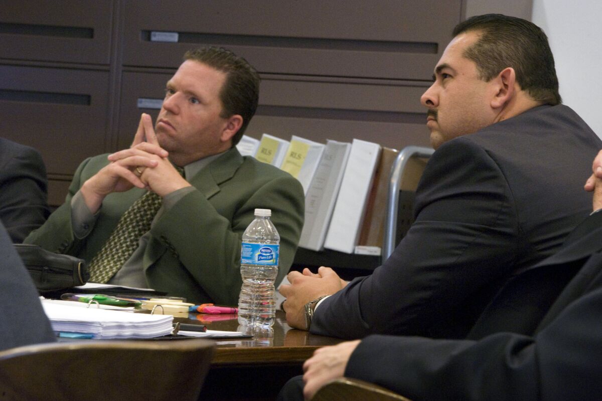Former Fullerton police officers Jay Cicinelli, left, and Manuel Ramos in court.