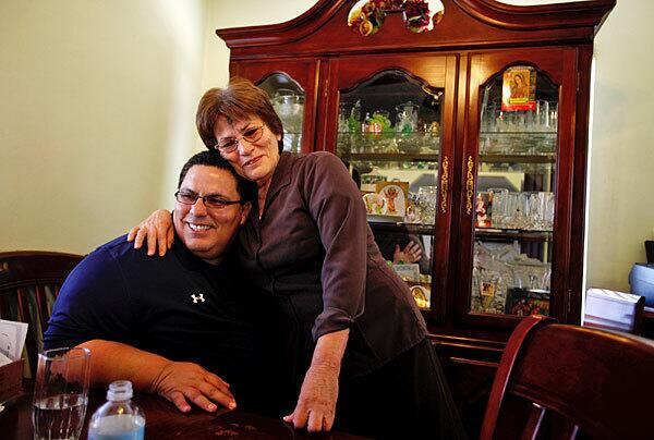 Hector Chacon visits with his mother, Paula Sarinana, 75, in Commerce. Chacon, 44, along with his nieces, nephews, brothers and sisters, has run or worked on more than 100 campaigns, including heated races for city councils, water districts and school boards. Three family members, including Chacon himself, have won public office.