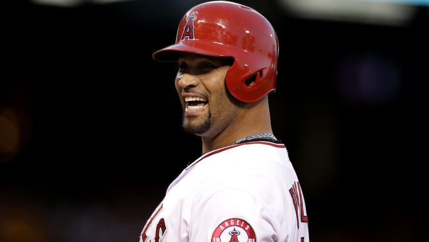 Angels first baseman Albert Pujols is all smiles during a doubleheaders against the Red Sox on July 20 in Anaheim.