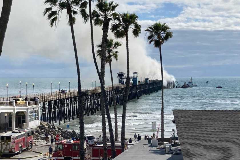 Firefighters and others quickly responded to a fire at the end of Oceanside Pier mid-afternoon Thursday