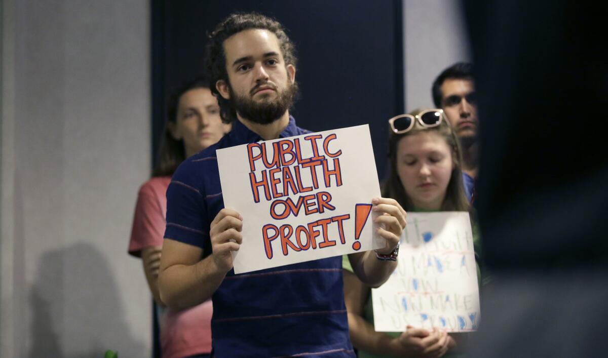 Members of the Texas Campaign for the Environment gather to deliver letters written in support of federal cleanup programs to the Environmental Protection Agency office in Dallas in 2017.