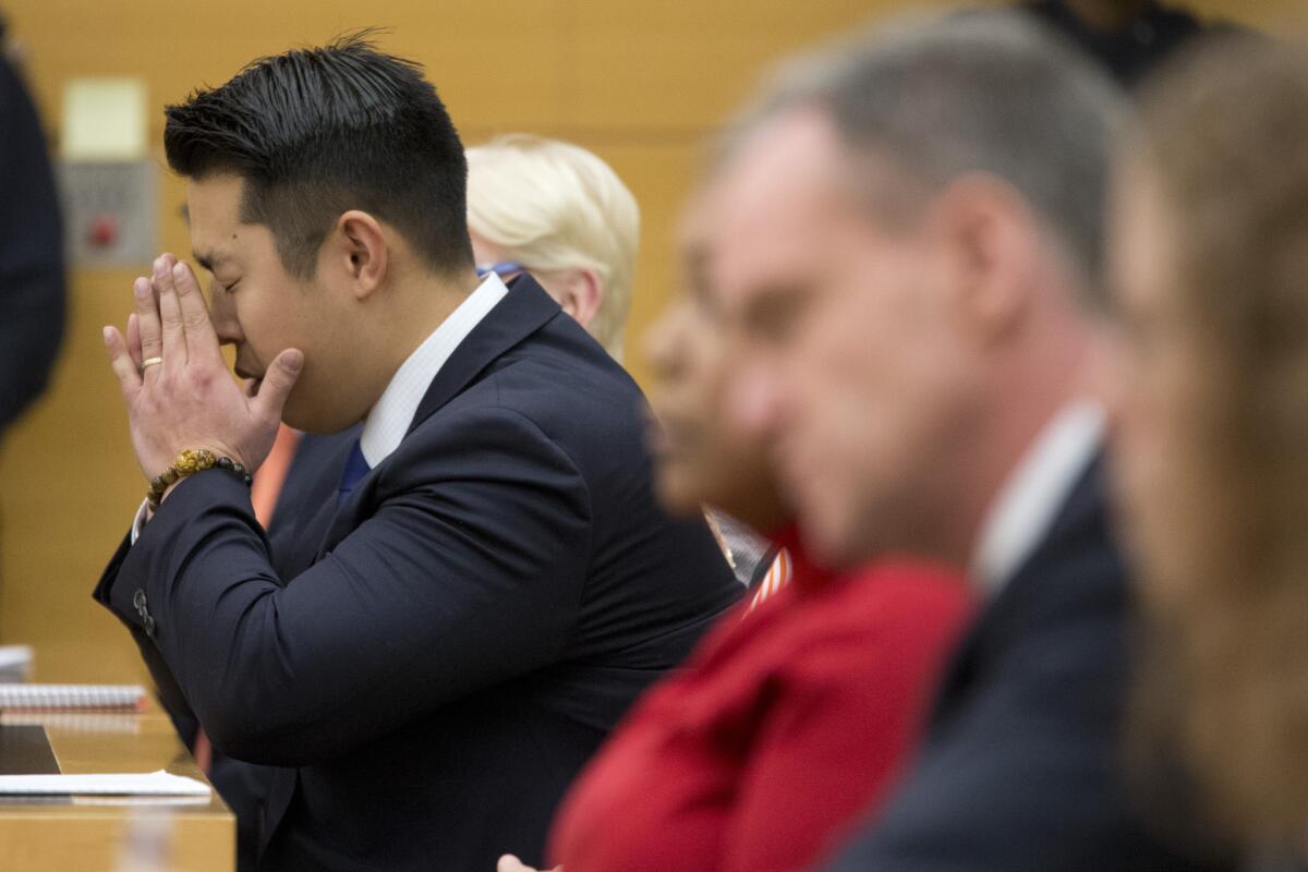 Peter Liang reacts as the verdict convicting him of manslaughter is read in court on Feb. 11.