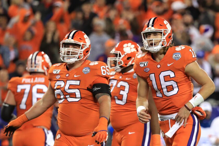CHARLOTTE, NORTH CAROLINA - DECEMBER 07: Trevor Lawrence #16 of the Clemson Tigers reacts after a touchdown against the Virginia Cavaliers during the ACC Football Championship game at Bank of America Stadium on December 07, 2019 in Charlotte, North Carolina. (Photo by Streeter Lecka/Getty Images)