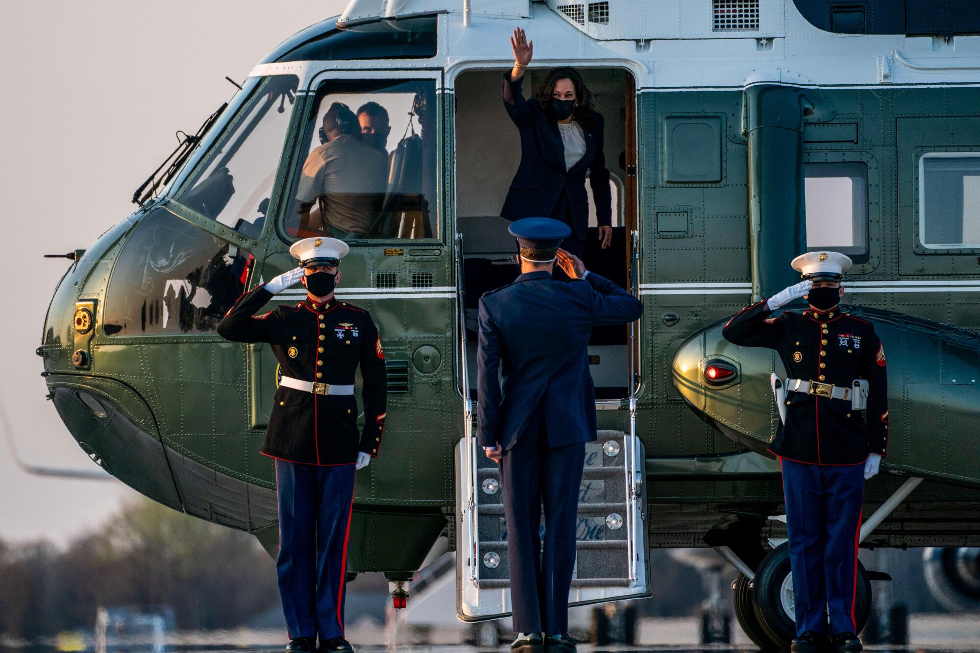 Vice President Kamala Harris waves from Marine 2.