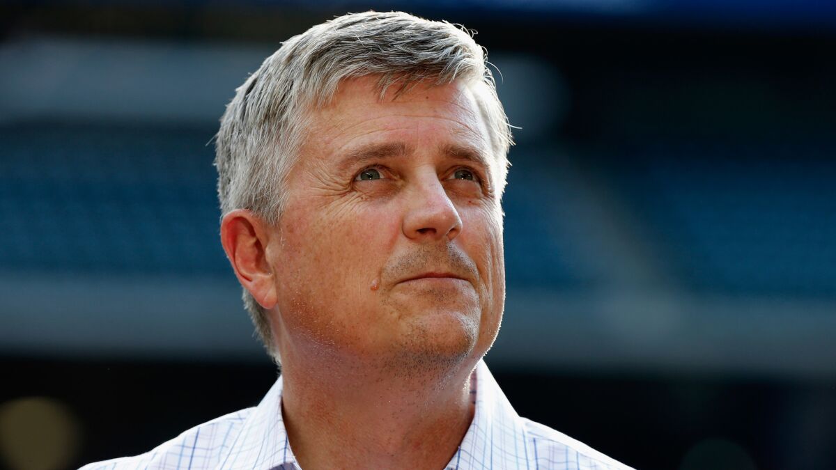 Houston Astros General Manager Jeff Luhnow, who once worked in the St. Louis Cardinals' front office, waits on the field before a game against the Baltimore Orioles on June 2, 2015.