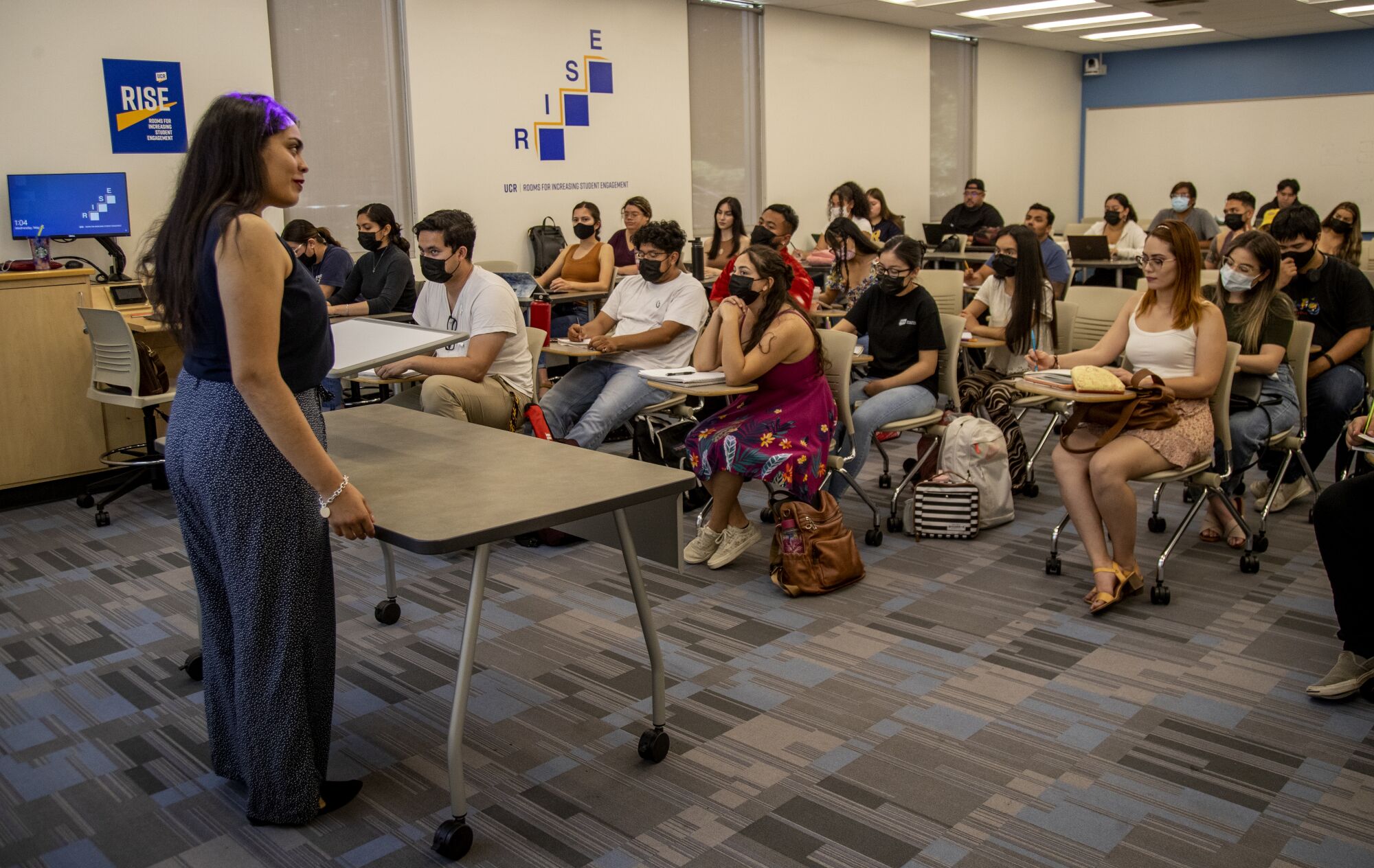 Cindy Escobedo gives a lecture to students at UC Riverside.