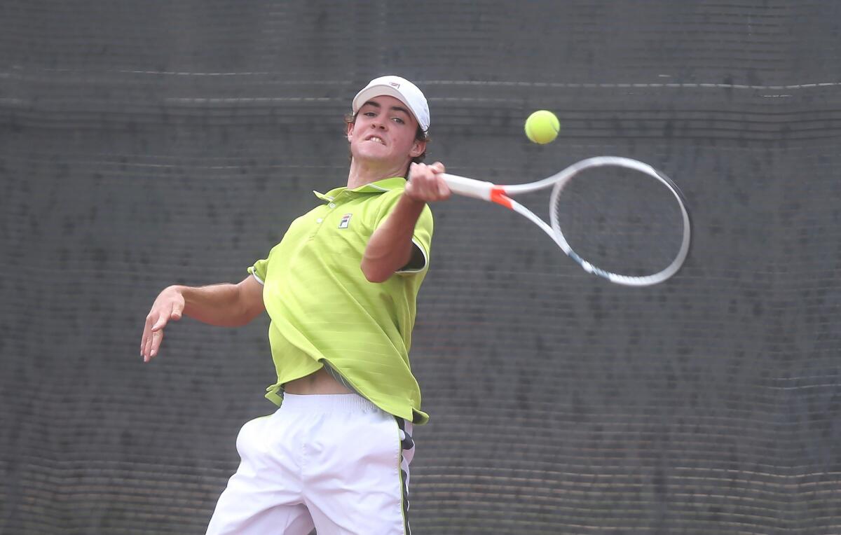Jett Cole of Laguna Beach runs down a forehand against Jean-Baptiste Badon of Sunland in the boys' 18-and-under round of 16 singles match at the USTA Southern California Junior Sectional Championships at Costa Mesa Tennis Center on Friday.