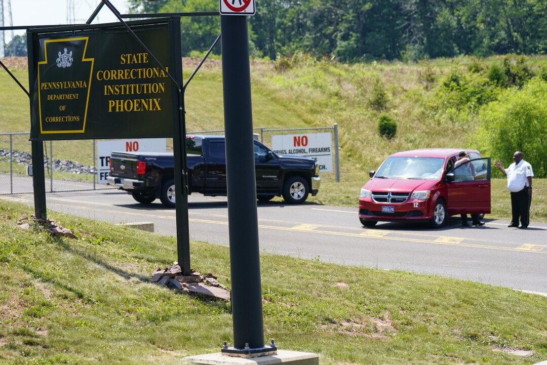 Security personnel are positioned at an entrance to the State Correctional Institution at Phoenix in Collegeville, Pa. 