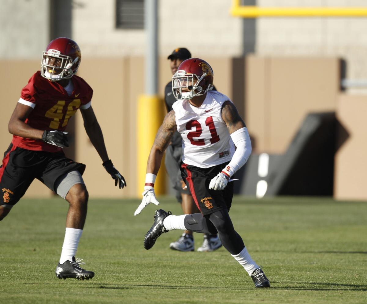 USC wide receiver Aaron Minor, left, and strong safety Su'a Cravens work out during the Trojans' spring practice on March 13.