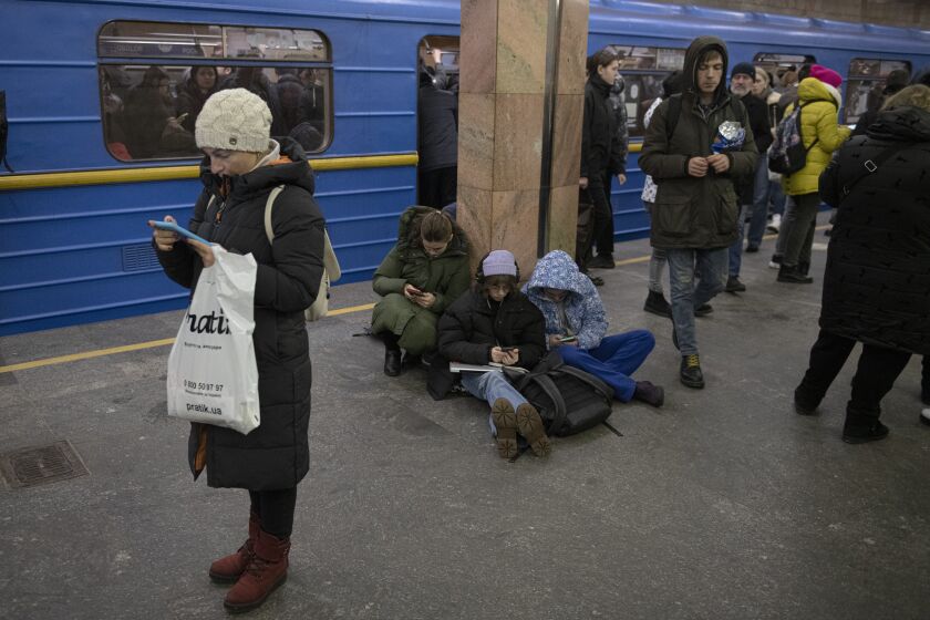 People rest in the subway station being used as a bomb shelter during a rocket attack in Kyiv, Ukraine, Monday, Dec. 5, 2022. Ukraine’s air force said it shot down more than 60 of about 70 missiles that Russia fired on in its latest barrage against Ukraine. It was the latest onslaught as part of Moscow’s new, stepped-up campaign that has largely targeted Ukrainian infrastructure and disrupted supplies of power, water and heat in the country as winter looms. (AP Photo/Andrew Kravchenko)