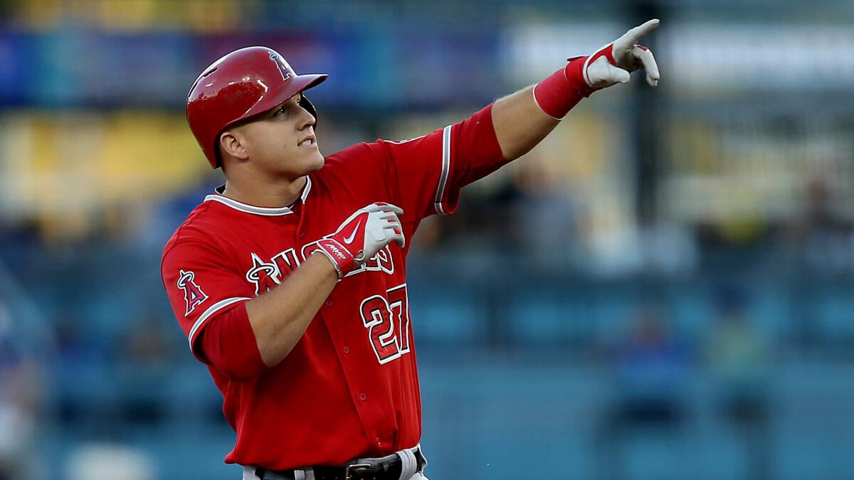 Angels center fielder Mike Trout gestures after hitting a double during a win over the Dodgers on Monday. Fox Sports West has been the biggest winner of the this year's Freeway Series.