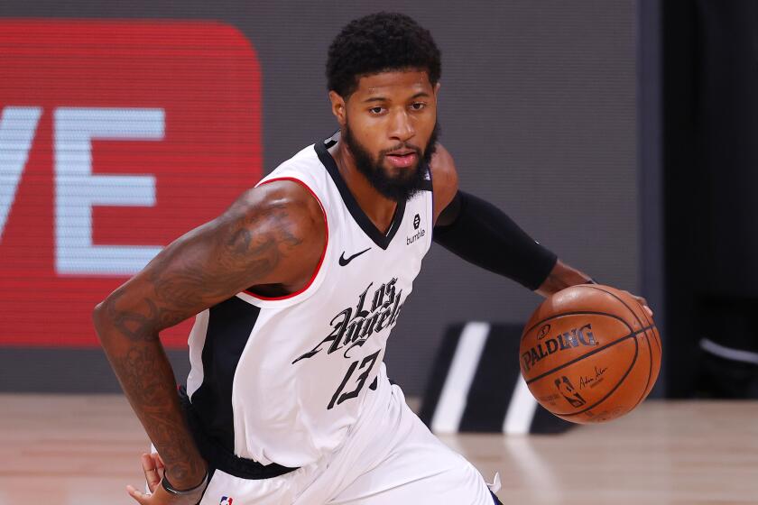 Clippers forward Paul George drives against the Dallas Mavericks during Game 3.