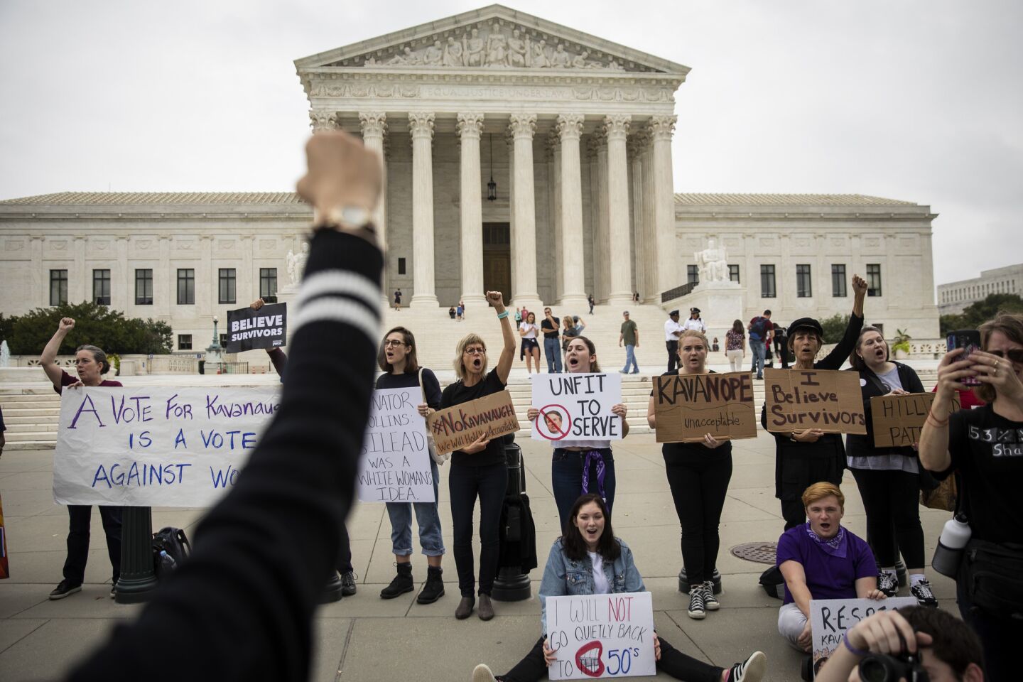 Anti-Kavanaugh protesters rally outside the Supreme Court on Saturday.