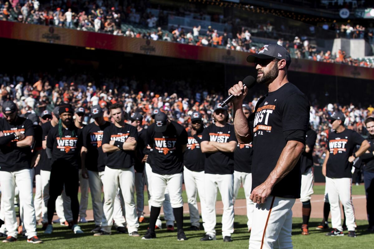 Giants manager Gabe Kapler addresses the fans and his team after San Francisco beat the San Diego Padres on Oct. 3, 2021.