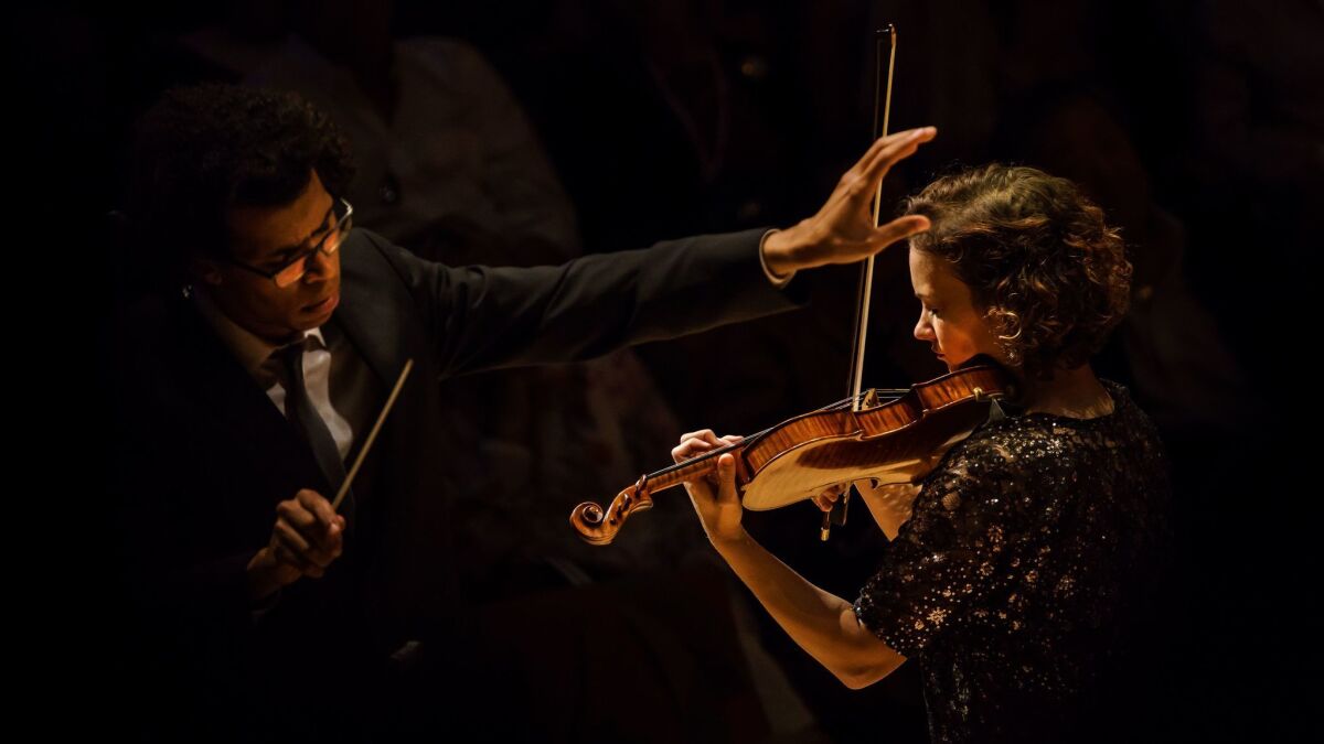 Conductor Jonathon Heyward and violin soloist Hilary Hahn perform Leonard Bernstein's Serenade with the Los Angeles Philharmonic in Walt Disney Concert Hall.