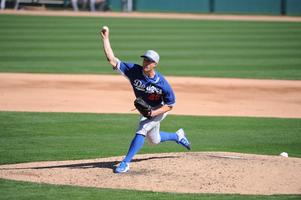 Dodgers pitcher Joe Wieland delivers a pitch in a spring training game against the Chicago White Sox.