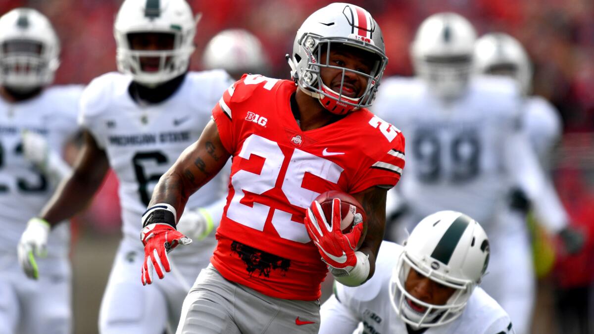 Buckeyes running back Mike Weber breaks into the clear against Michigan State on a 47-yard touchdown run during the first quarter Saturday.