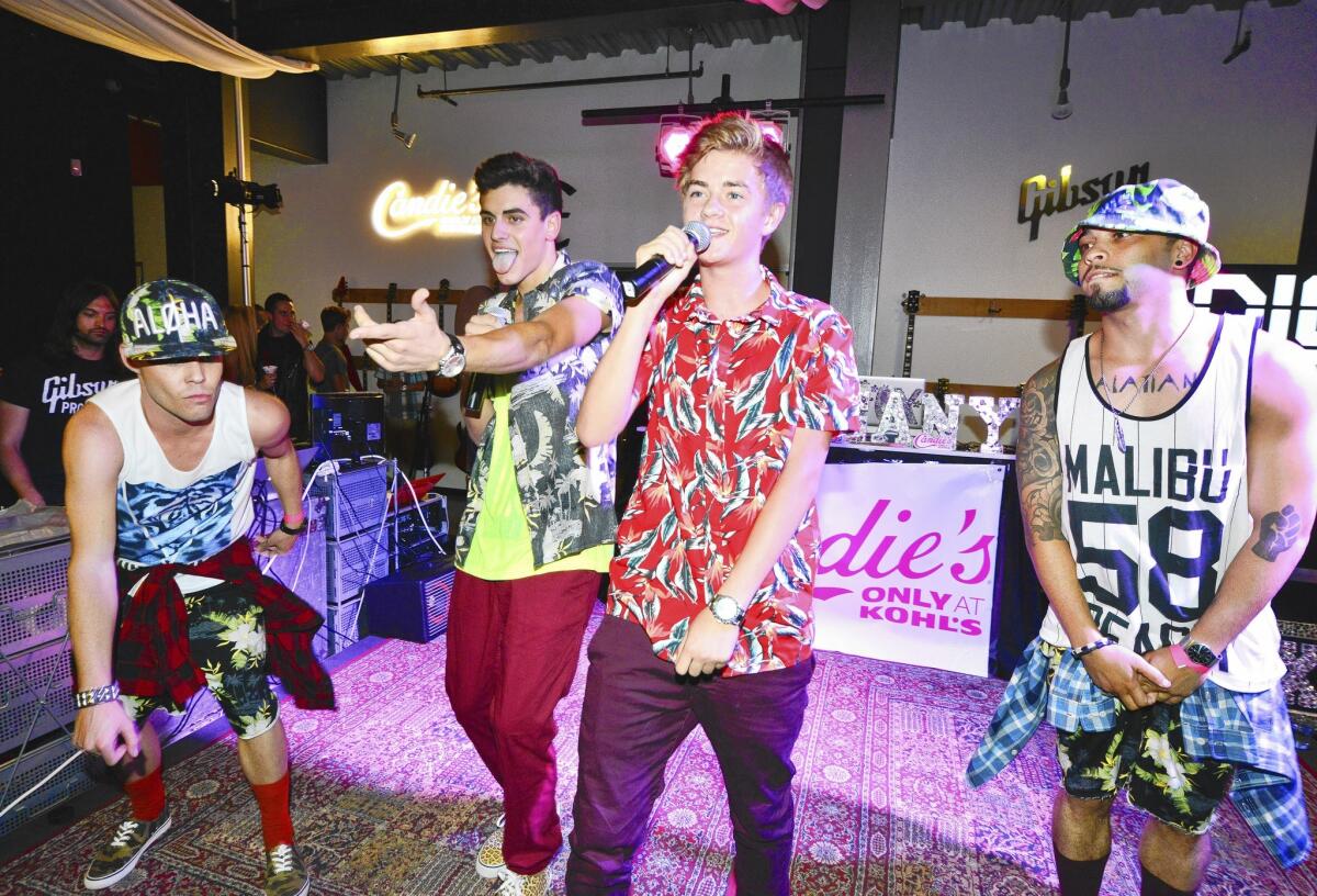 Jack Gilinsky, second from left, and Jack Johnson of social media duo Jack & Jack perform at a preshow for this year's Teen Choice Awards.
