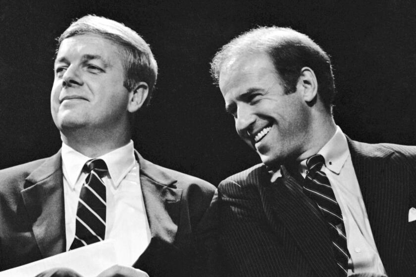 FILE - Maine Gov. Joseph Brennan, left, enjoys a laugh with U.S. Sen. Joseph Biden of Delaware during the opening ceremonies at Maine's Democratic presidential straw poll in Augusta, Maine, Friday, Sept. 30, 1983. Brennan, whose hardscrabble childhood shaped his working class views in a political career that included two terms as governor and two terms in the US. House, died Friday evening, April 5, 2024, at his home in Portland, Maine. He was 89. (AP Photo/Pat Wellenbach, File)