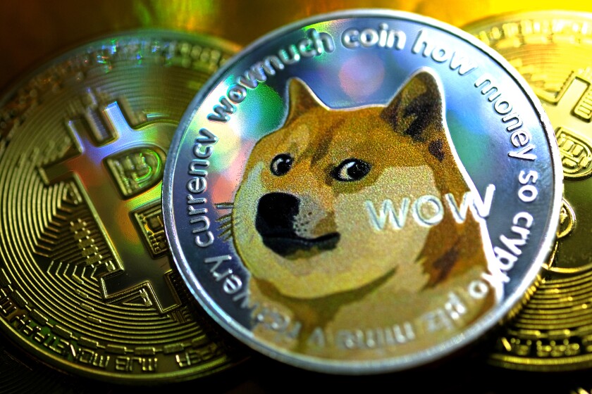 Atop a pile of gold coins is one with an image of a dog and, among other words, "Wow."