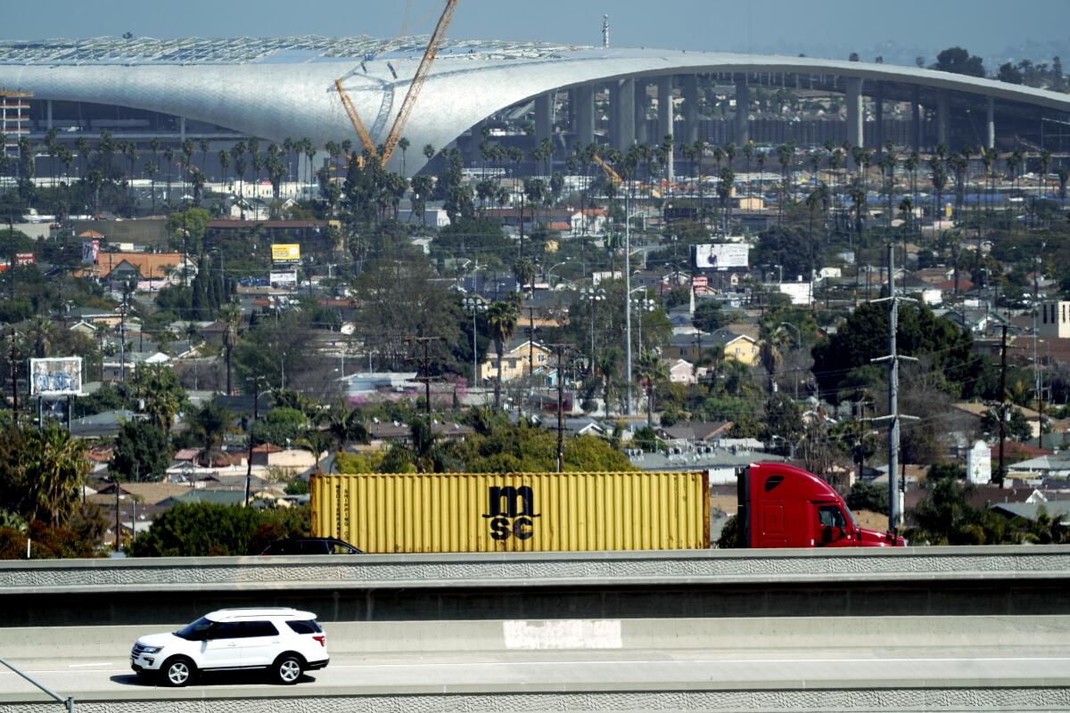 Freeway traffic passes in front of the SoFi Stadium on March 4.