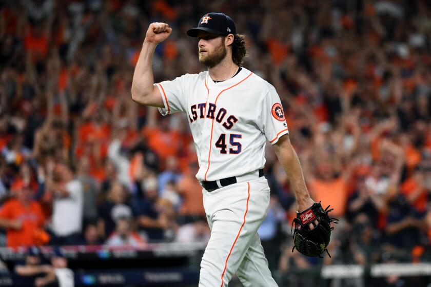 HOUSTON, TX - OCTOBER 10: Gerrit Cole #45 of the Houston Astros reacts after a double play ends the top of the seventh inning during Game 5 of the ALDS between the Tampa Bay Rays and the Houston Astros at Minute Maid Park on Thursday, October 10, 2019 in Houston, Texas. (Photo by Cooper Neill/MLB Photos via Getty Images)