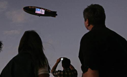 The Goodyear Blimp does a fly-over as hundreds of people gather at the Barker Hangar at the Santa Monica Airport to remember Griffith Lisle Hoerner, who died in a plane crash off Malibu in October. He was fondly called "Griff," and as an experienced pilot he was a beloved member of the aviation community. More photos >>>