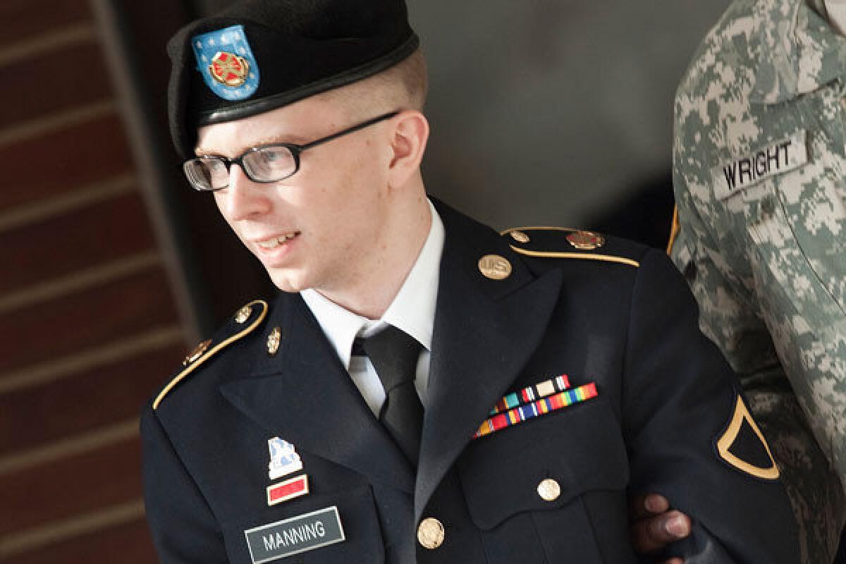Pfc. Bradley Manning is escorted following a motions hearing in the case U.S. vs. Manning at Ft. Meade, Md.